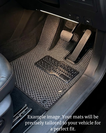 Grey EVA car mat fitted in a vehicle footwell, showing tailored floor coverage and a metal heel pad